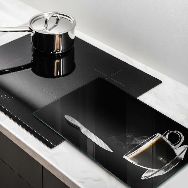 Tagliere in vetro Un bicchiere di caffè caldo