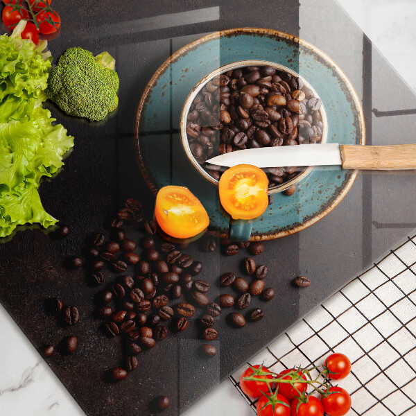 Tagliere in vetro Una tazza di chicchi di caffè