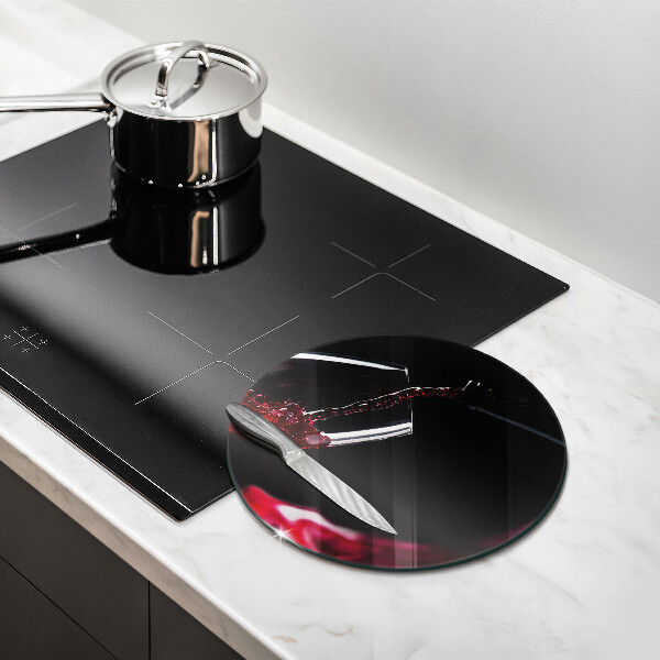 Tagliere in vetro Un bicchiere di vino rosso