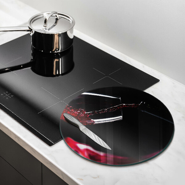 Tagliere in vetro Un bicchiere di vino rosso