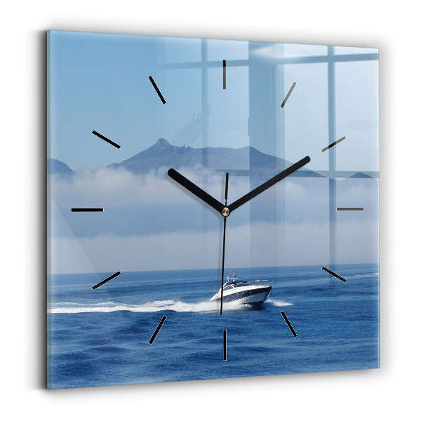 Orologio quadrato Una barca che galleggia sull'oceano