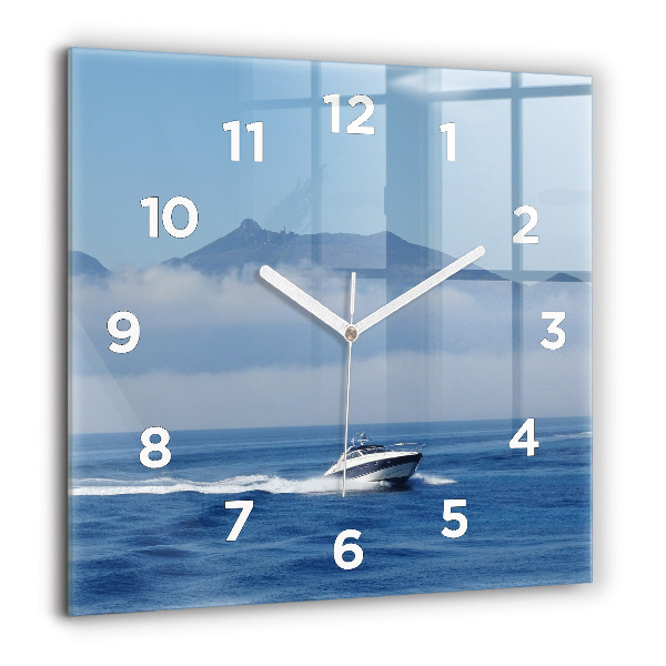 Orologio quadrato Una barca che galleggia sull'oceano