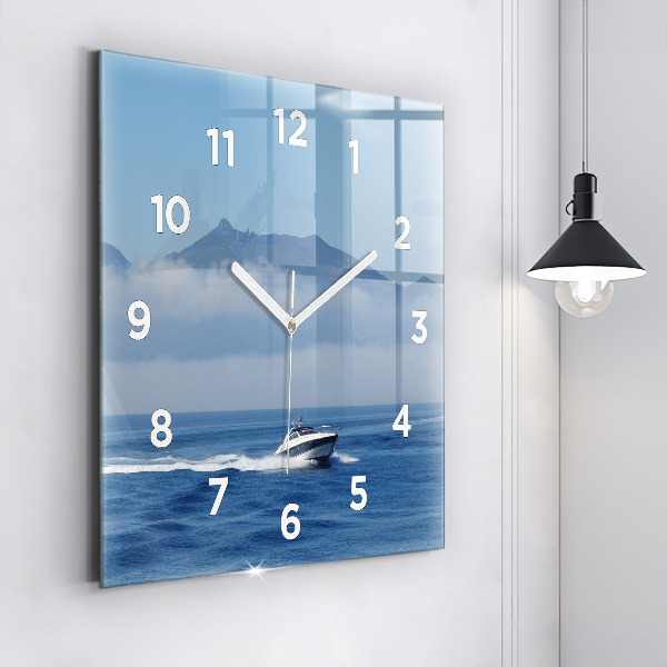 Orologio quadrato Una barca che galleggia sull'oceano
