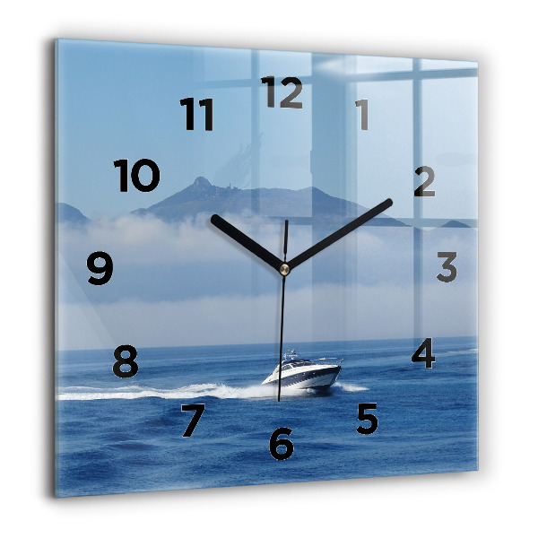 Orologio quadrato Una barca che galleggia sull'oceano