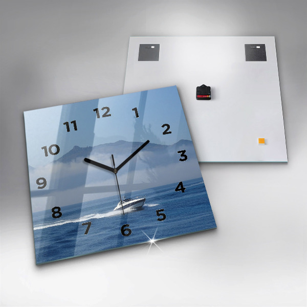 Orologio quadrato Una barca che galleggia sull'oceano