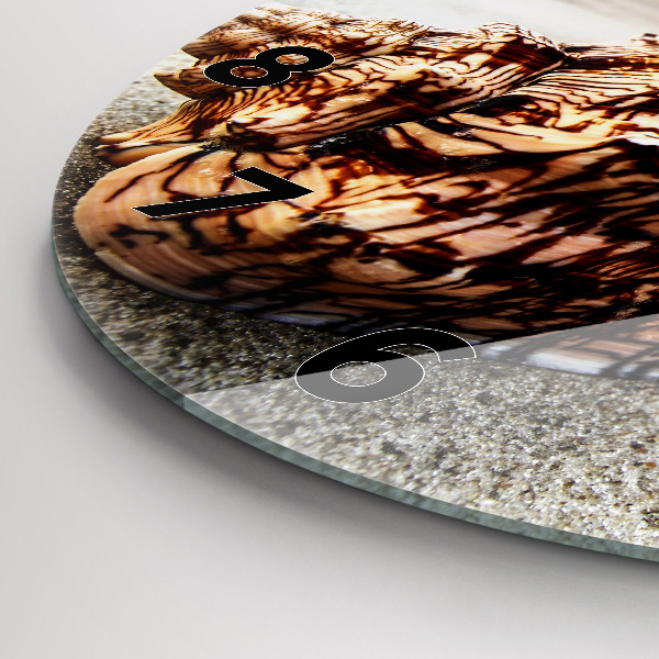 Orologio rotondo Una conchiglia sulla spiaggia