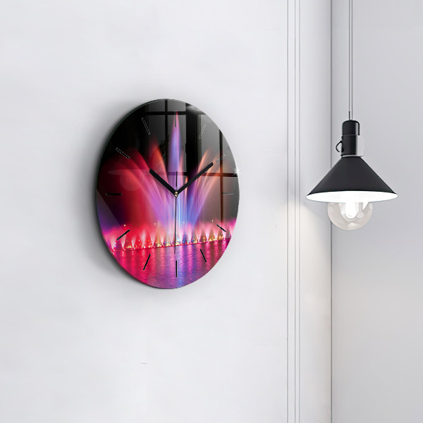 Orologio rotondo Fontana di Wroclaw di notte