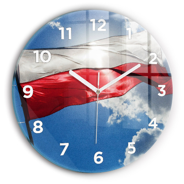 Orologio rotondo in vetro La bandiera polacca contro il cielo